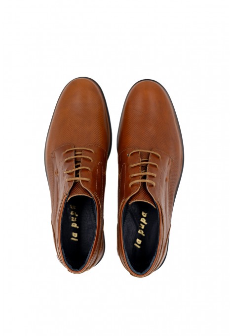 Man’s brown shoes.