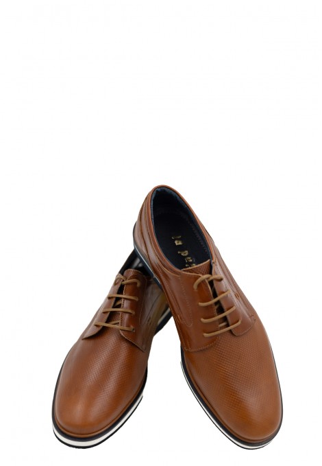 Man’s brown shoes.
