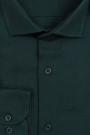 La pupa σκούρο πράσινο πουκάμισο με σχέδιο ύφανσης
